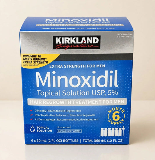 Kirkland Minoxidil 5% box in a cream studio setting