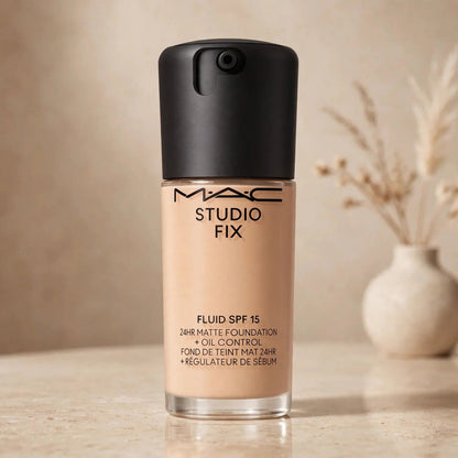 MAC Studio Fix Fluid SPF 15 foundation NC27 in warm beige studio setting