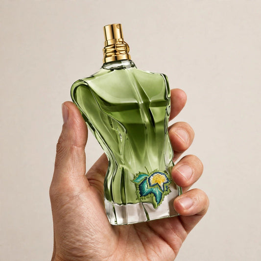 Hand holding Jean Paul Gaultier Le Beau Paradise Garden EDP perfume bottle