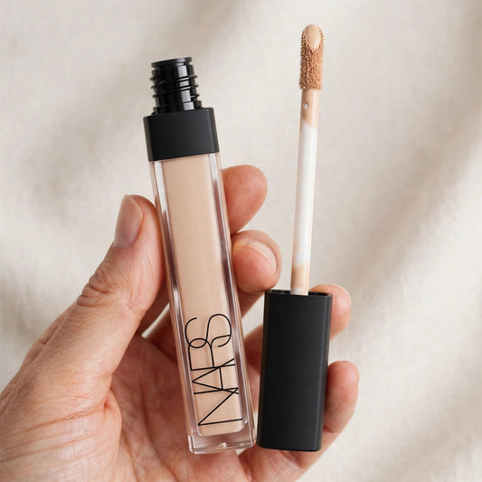 Hand holding NARS Radiant Creamy Concealer