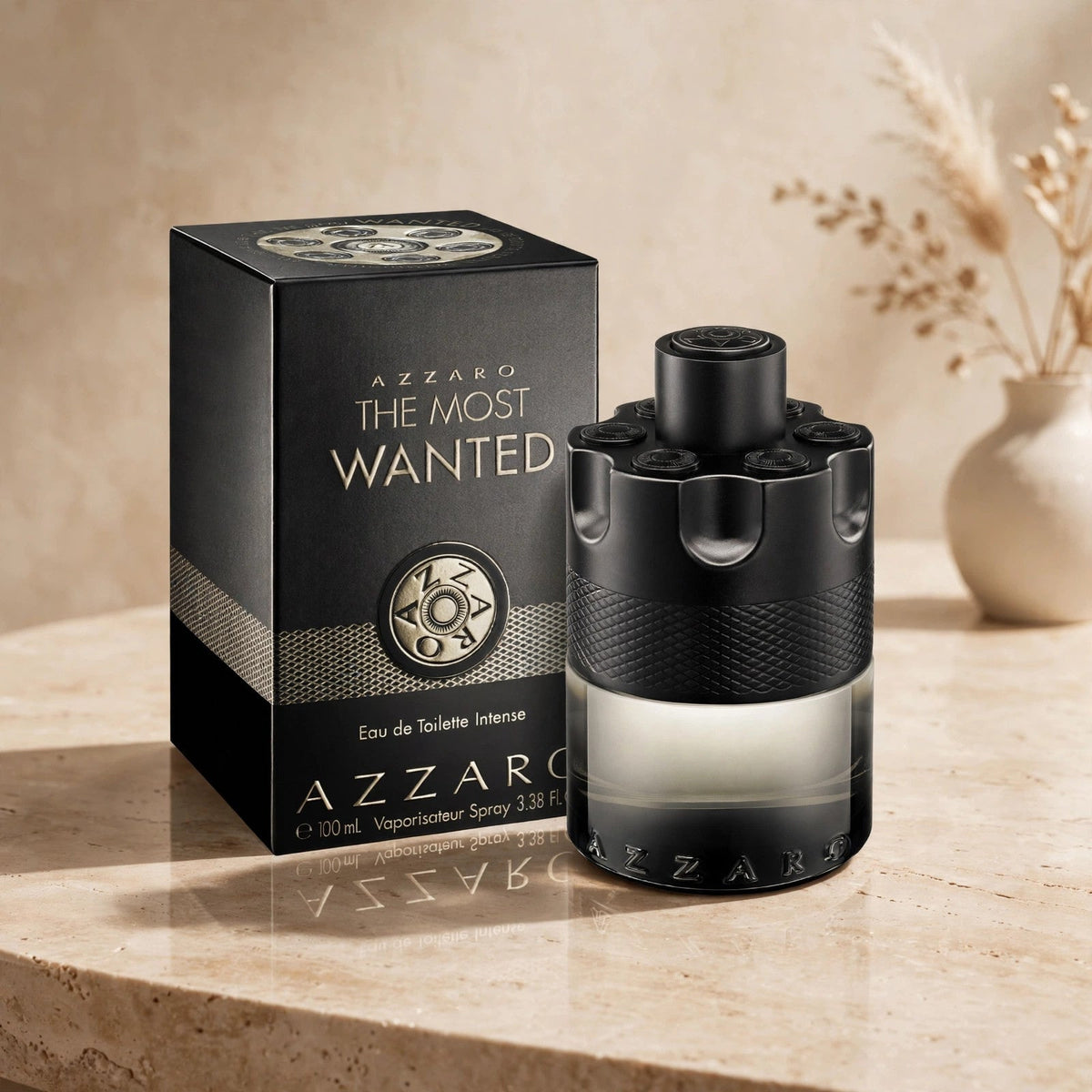 Azzaro The Most Wanted Eau de Parfum Intense 100ml bottle and box in warm beige studio